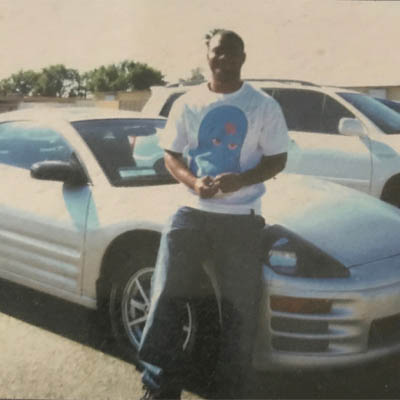 Demel McCain with his car.