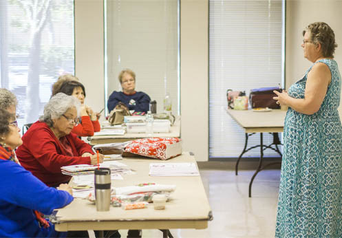 students paying attention to their instructor in class.