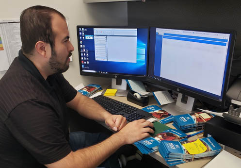 A DSS student working on a computer