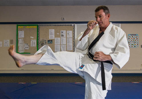 The NOCE karate instructor performing a kick