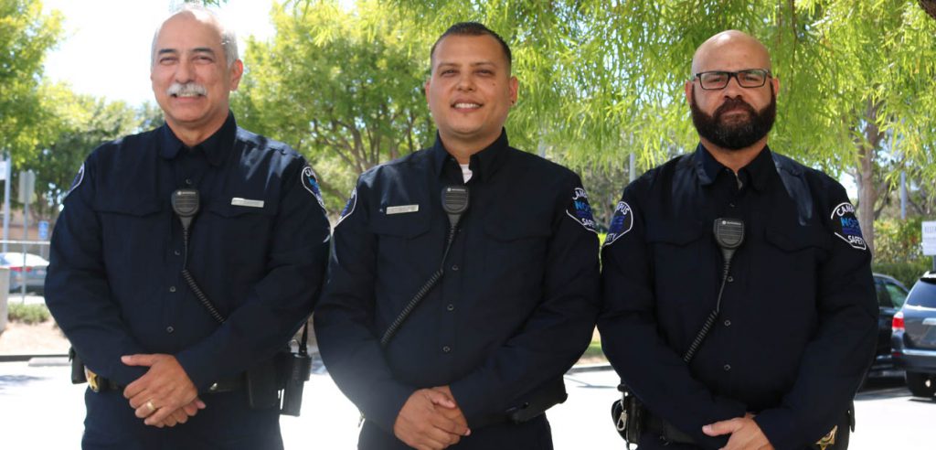 A photo of the three on duty security officers at the Anaheim Campus.