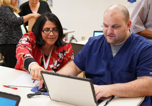 A Career Resource Center instructor helping a student.