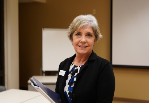 Student smiles in the career resource center