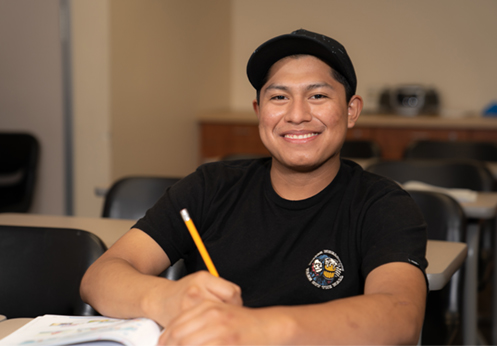 a smiling esl student in the esl learning center