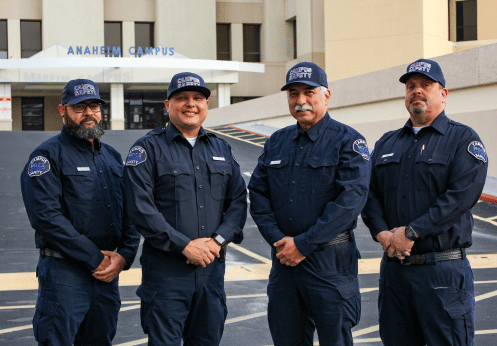 A group photo of the four male Anaheim Campus Safety officers.